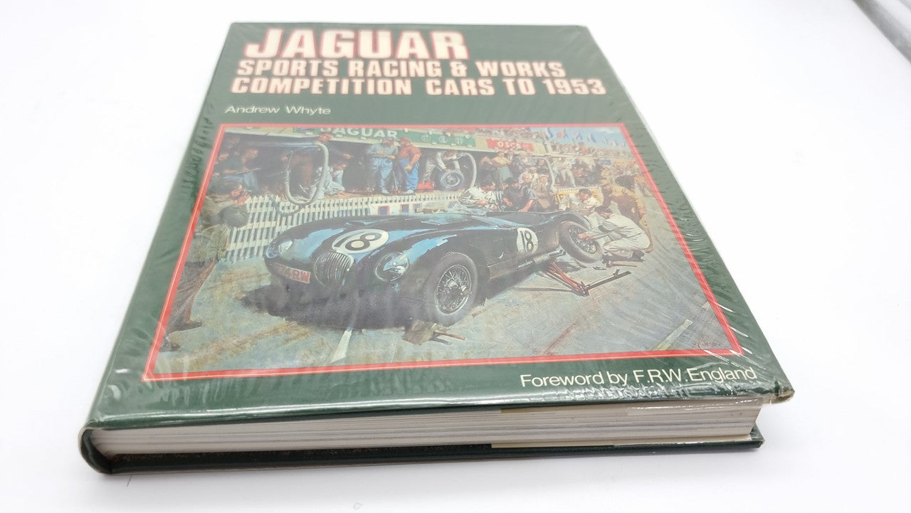Jaguar sports racing book, closed dark green hardcover with race car cover illustration