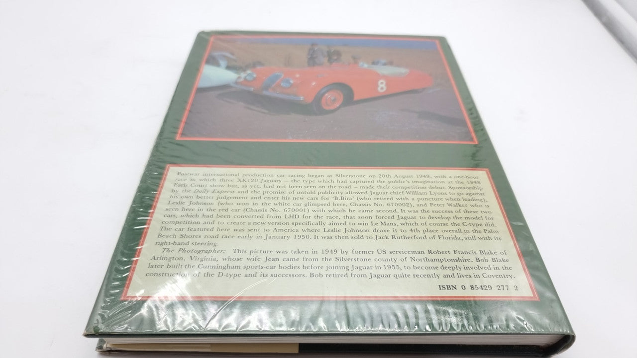 Jaguar sports racing book, angled back cover with red-bordered car photo and text panel