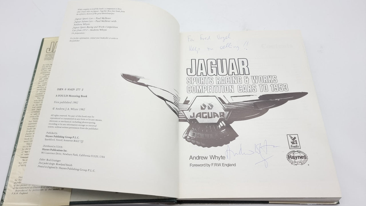 Jaguar sports racing book, open spread with winged Jaguar line illustration and credits