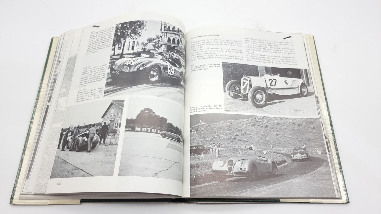 Racing cars history book, open spread with black-and-white photos and captions