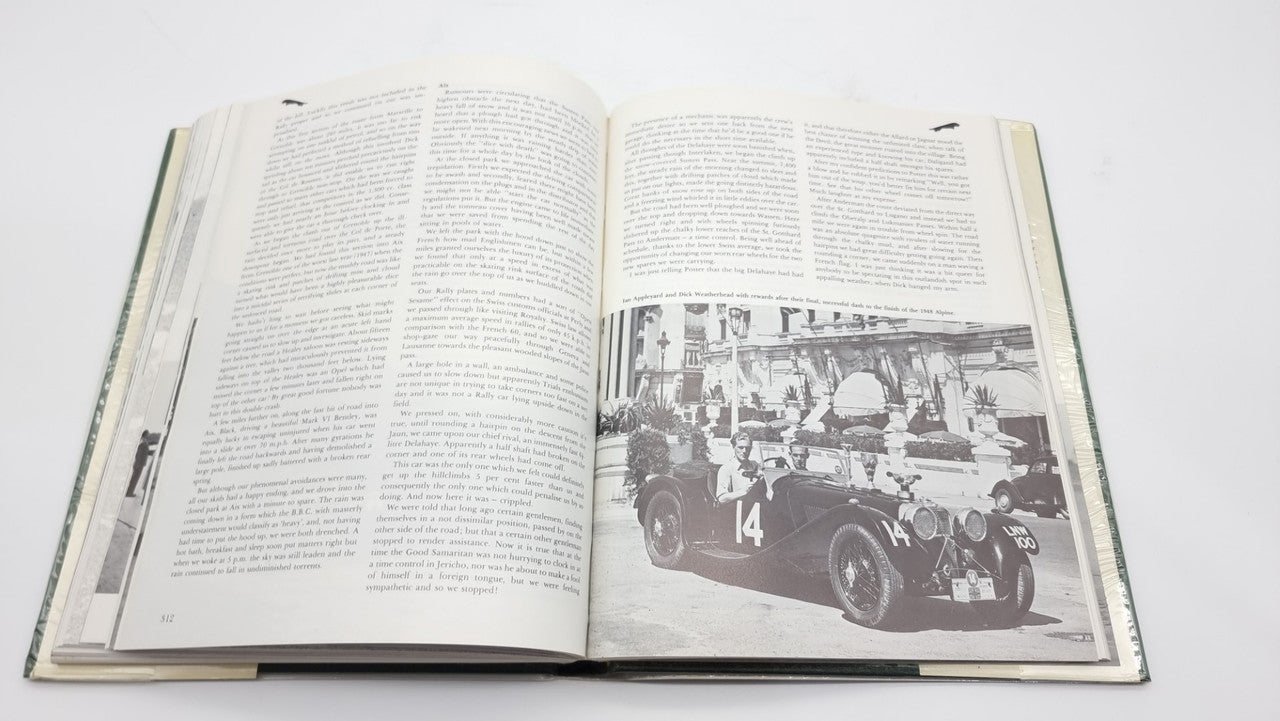 Racing cars history book, open spread with race car photo and blocks of text
