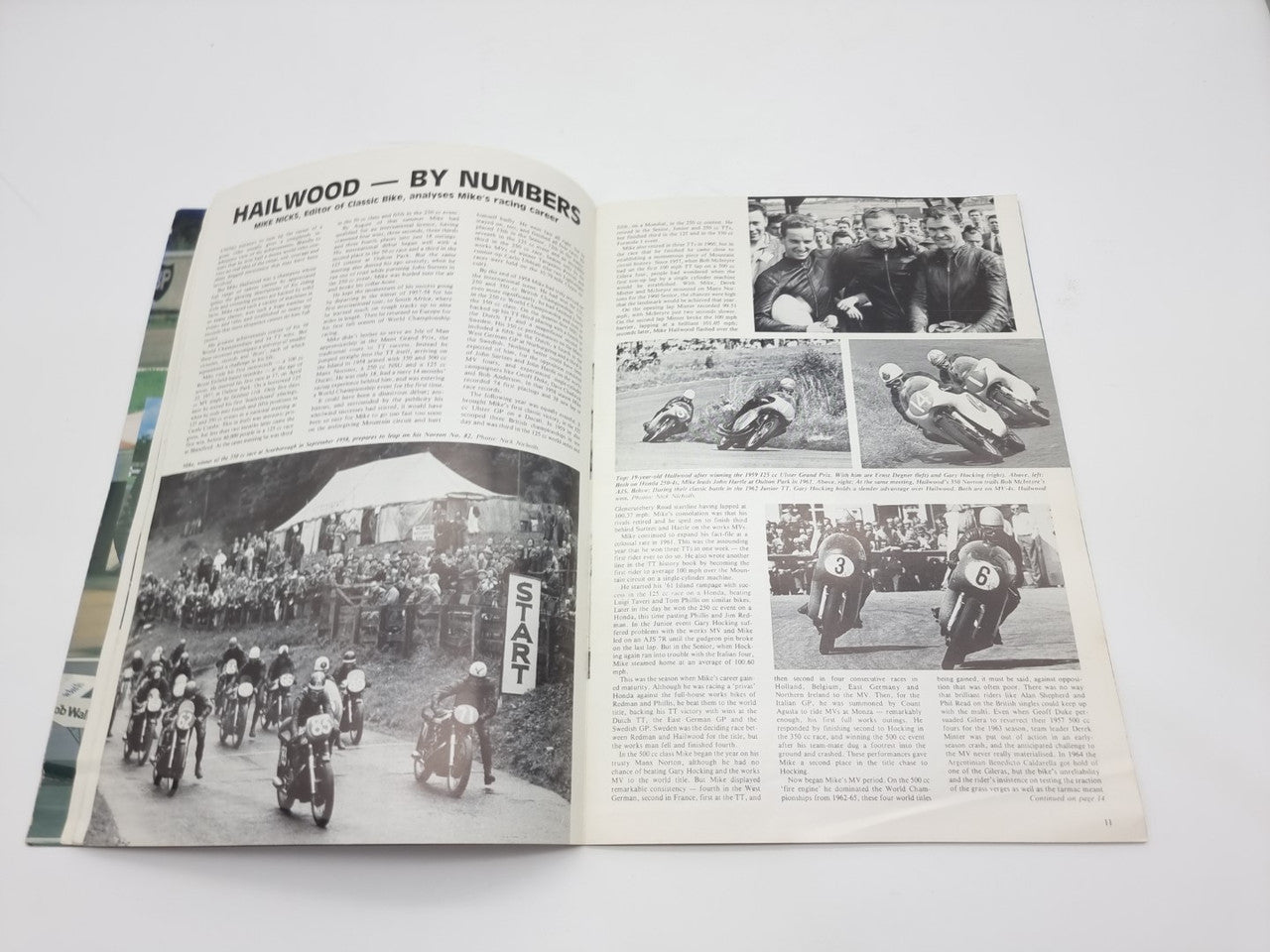 Motor racing programme booklet opened, “Hailwood by numbers” article with race photos