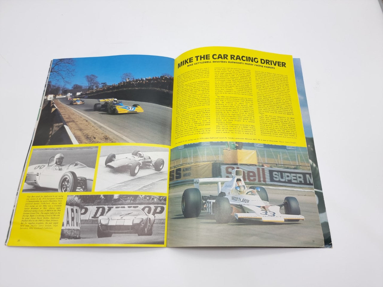 Motor racing programme booklet opened, yellow-highlight pages with race images and text