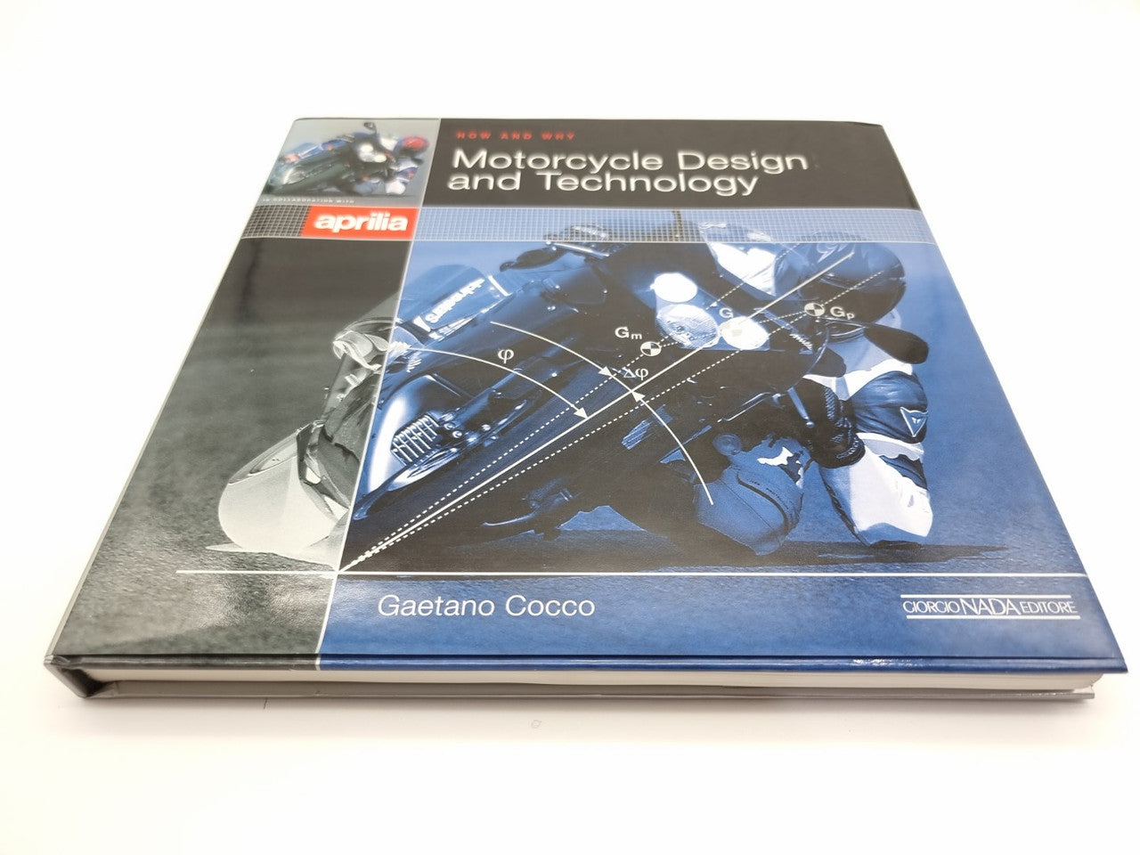 Motorcycle design and technology book with Aprilia logo on a blue front cover.