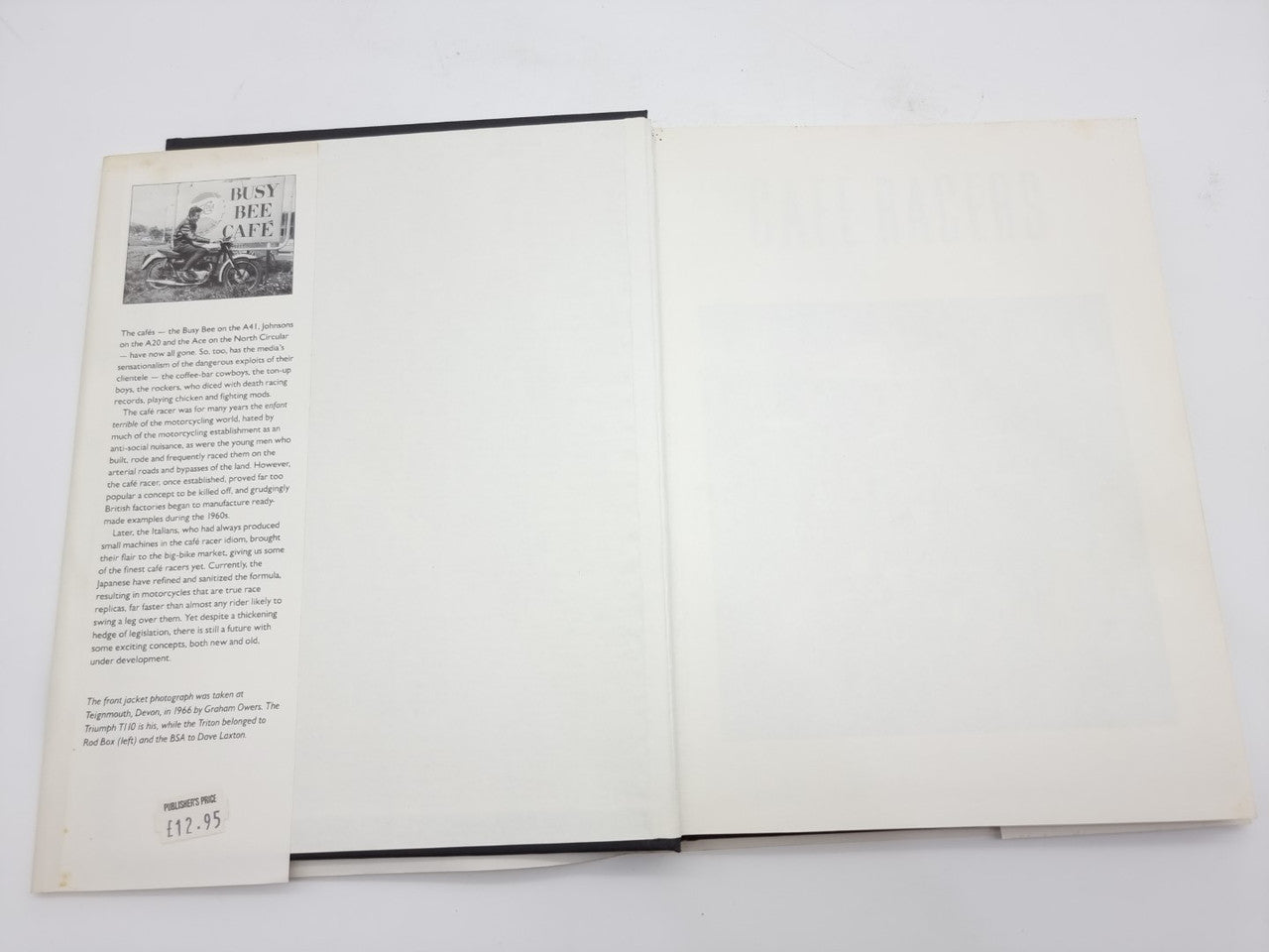 Open paperback book with text on both pages and a small black-and-white photo inset