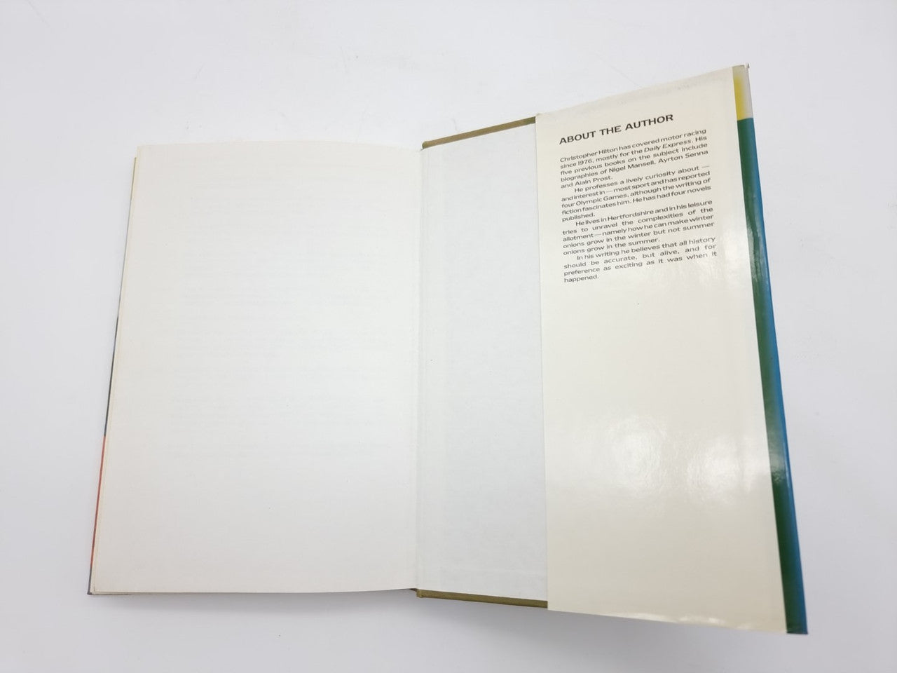 Book open showing About the Author section and blank right page