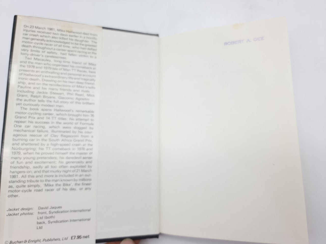 Book with open pages: printed text on left, blank page on right.