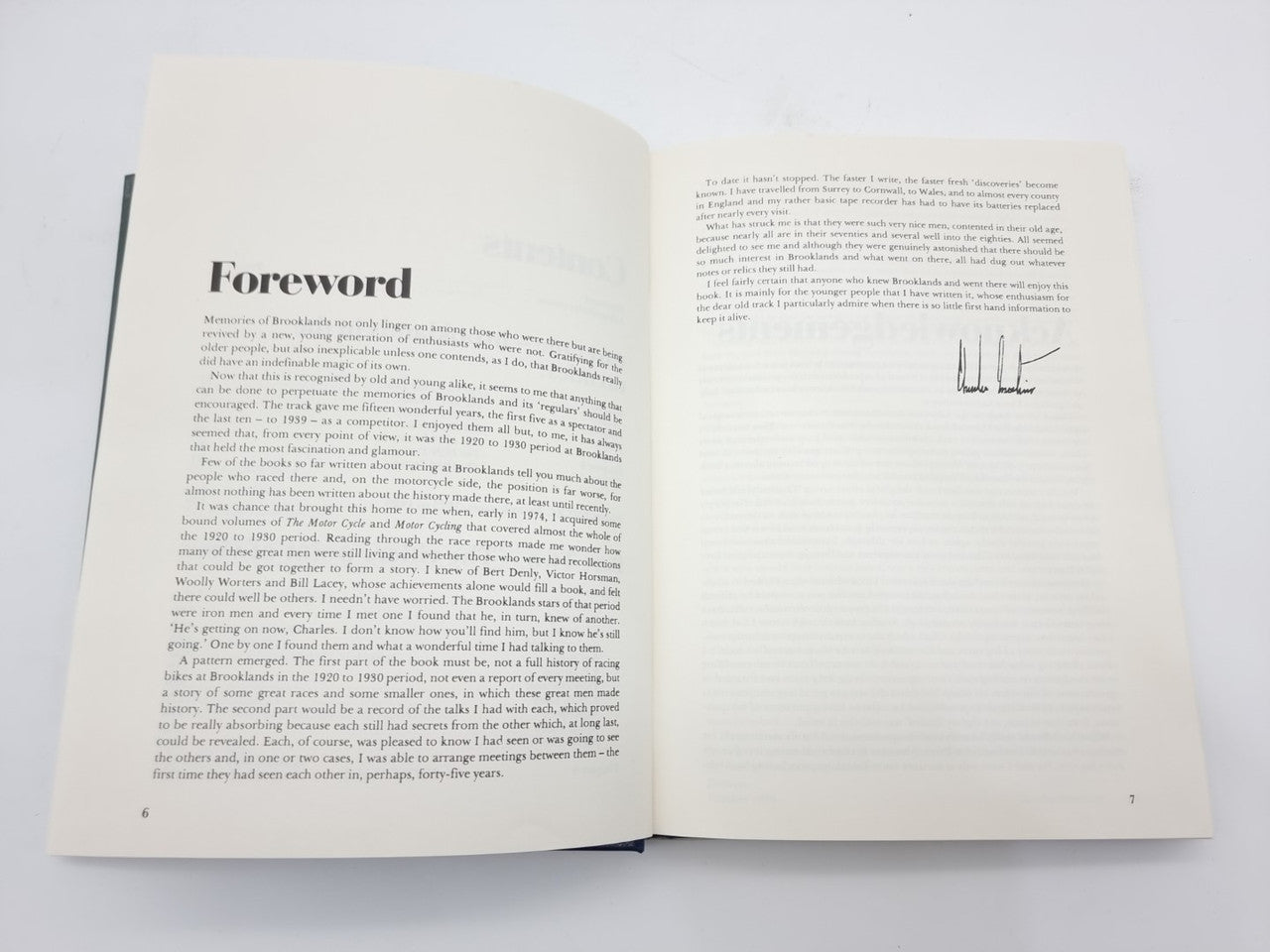 Open book pages showing “Foreword” heading and dense body text.