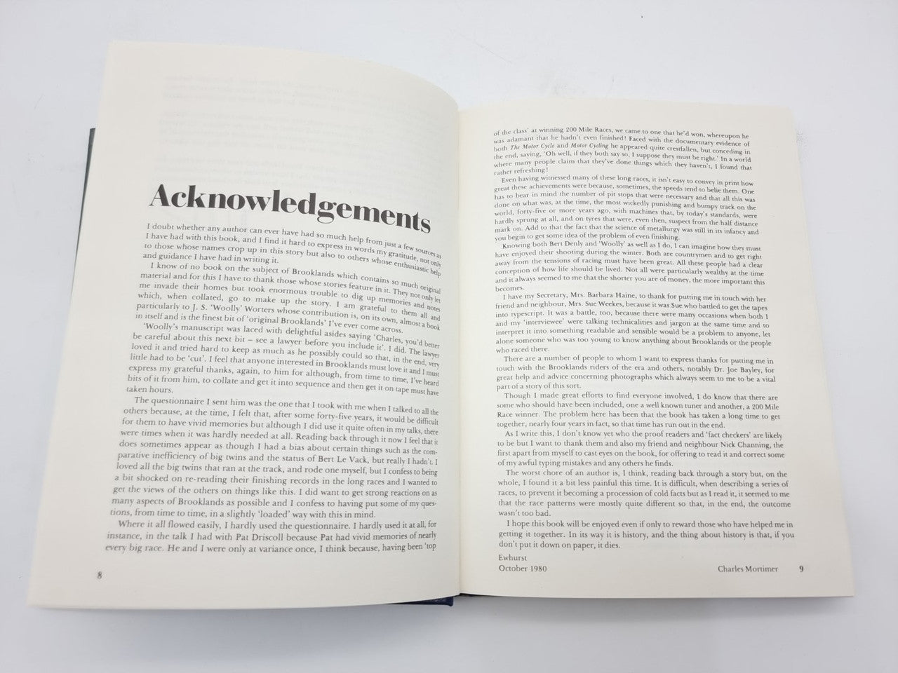 Open book pages showing “Acknowledgements” heading and dense body text.