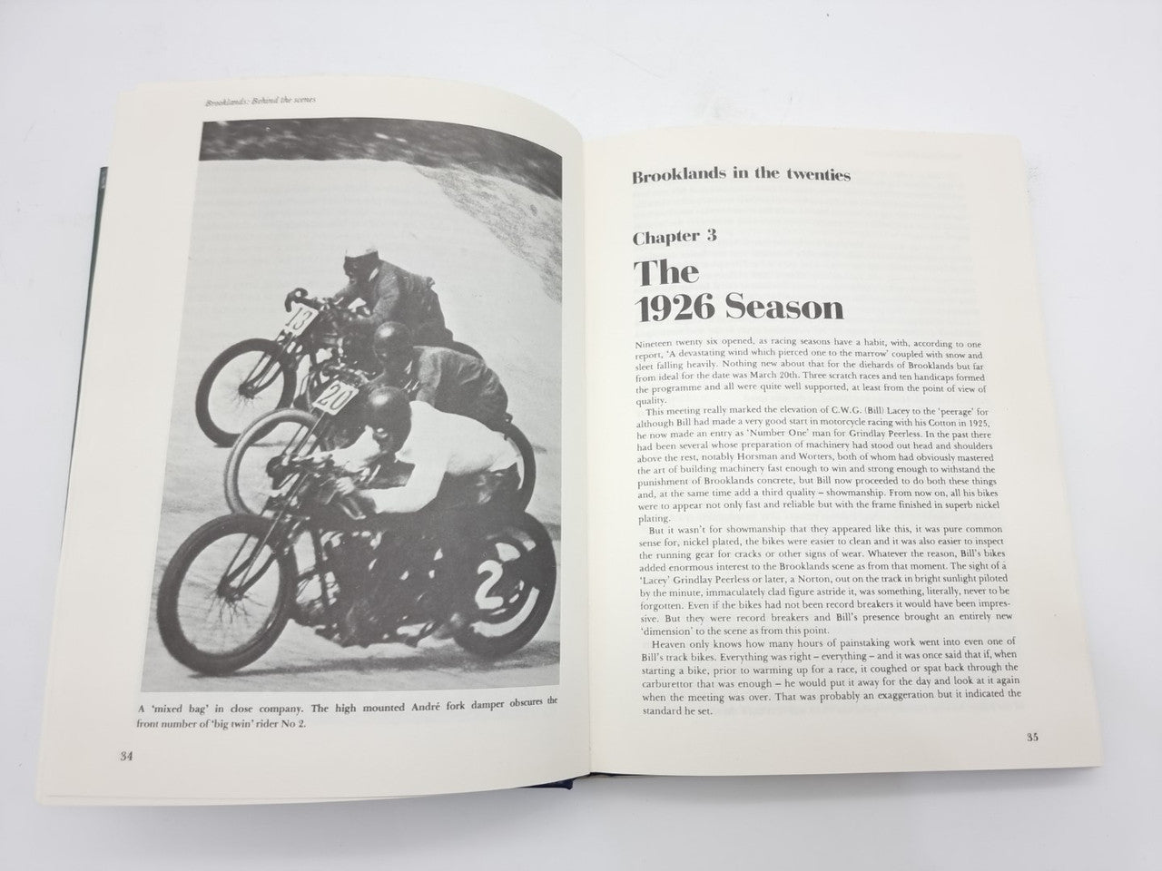Open book spread with motorcycle photo on left and chapter “1926 Season” on right.