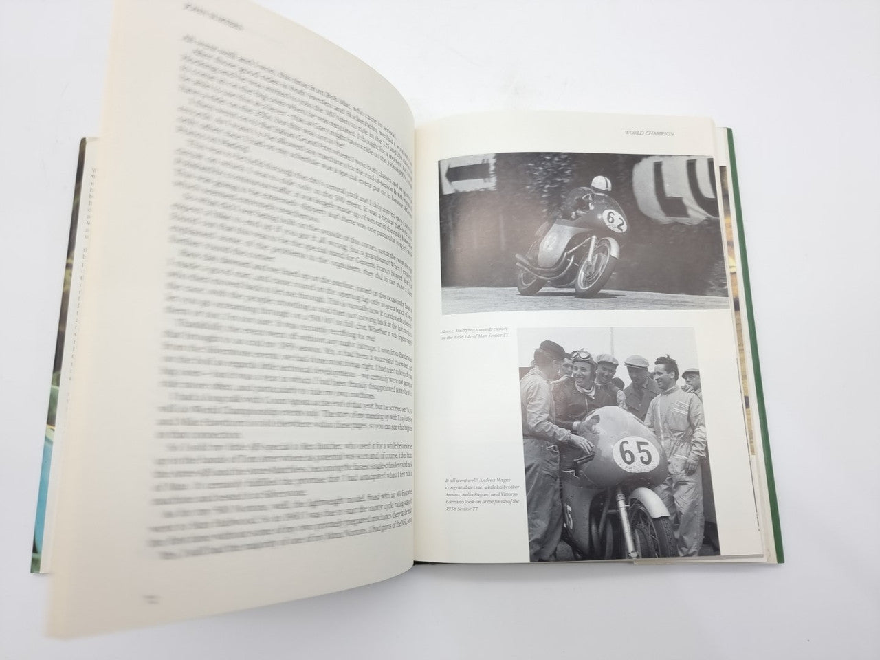 Open John Surtees World Champion book page with black-and-white racing photos