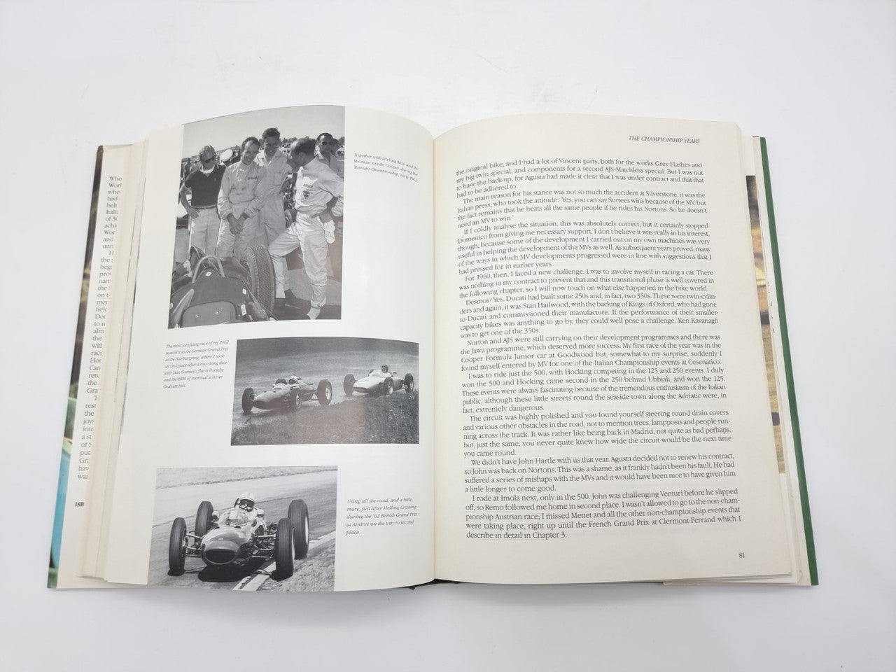 Open motorsport book with dense text and three black-and-white race photos