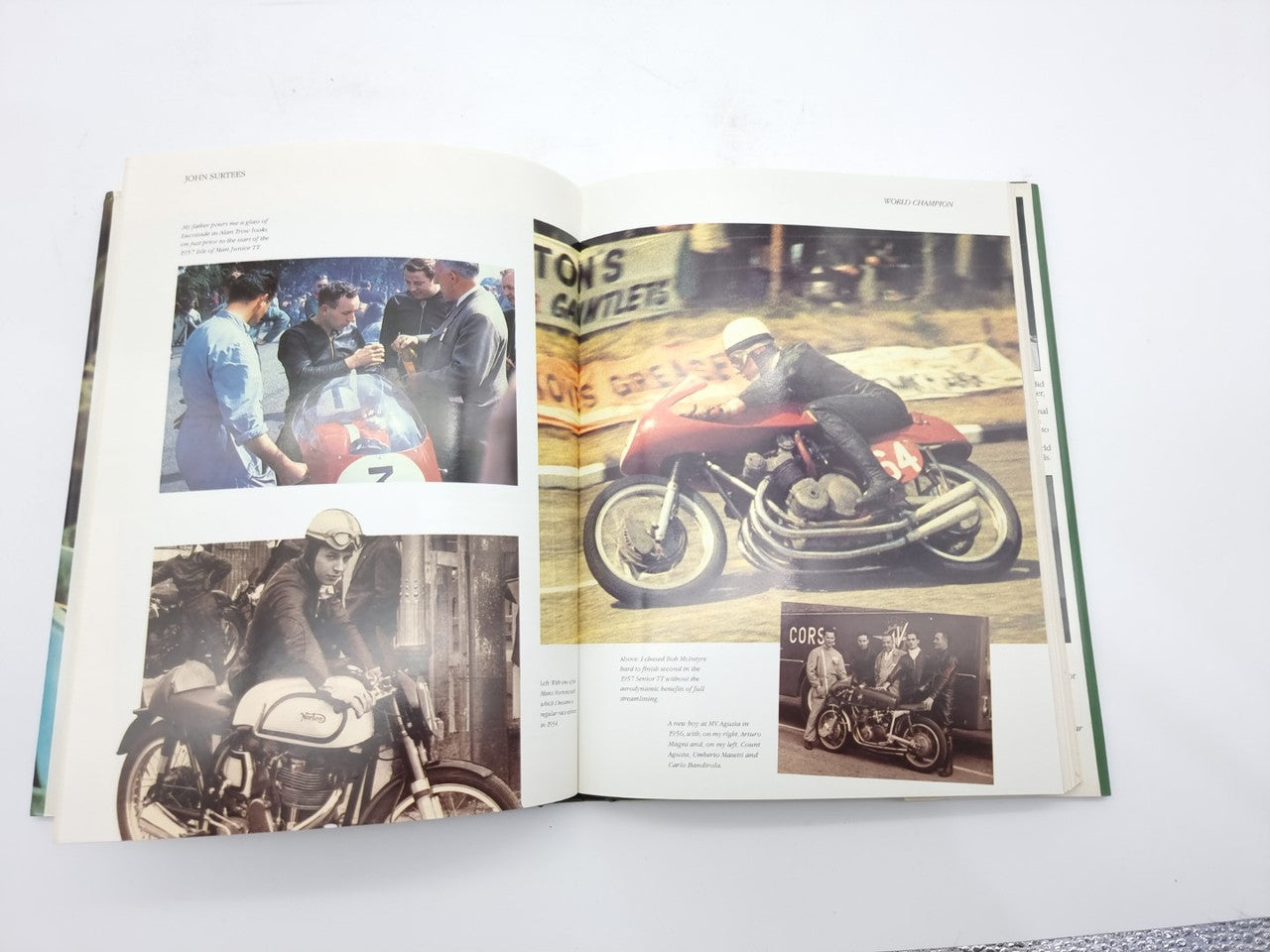 Open motorsport biography book with race photos on both pages