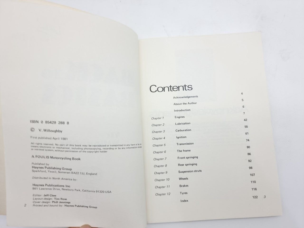 Open paperback book showing Contents page with chapter list and page numbers