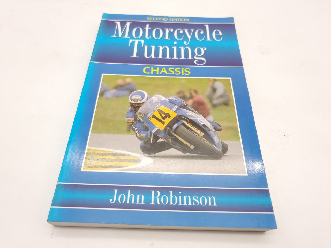 Motorcycle Tuning chassis book cover with John Robinson and motorcycle racing photo