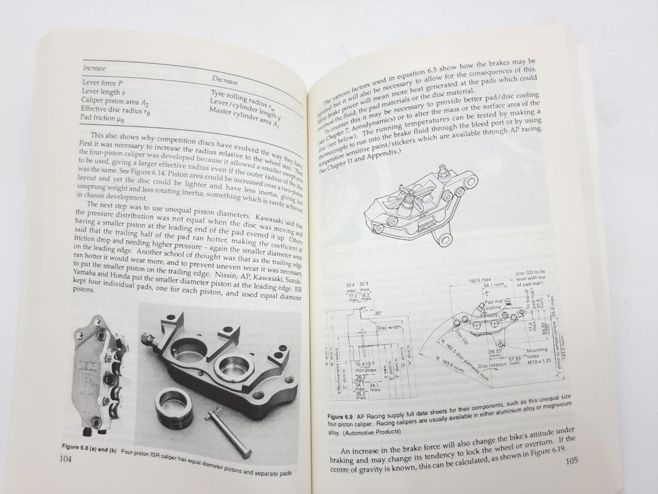Motorcycle Tuning chassis book open to technical page with diagrams and parts