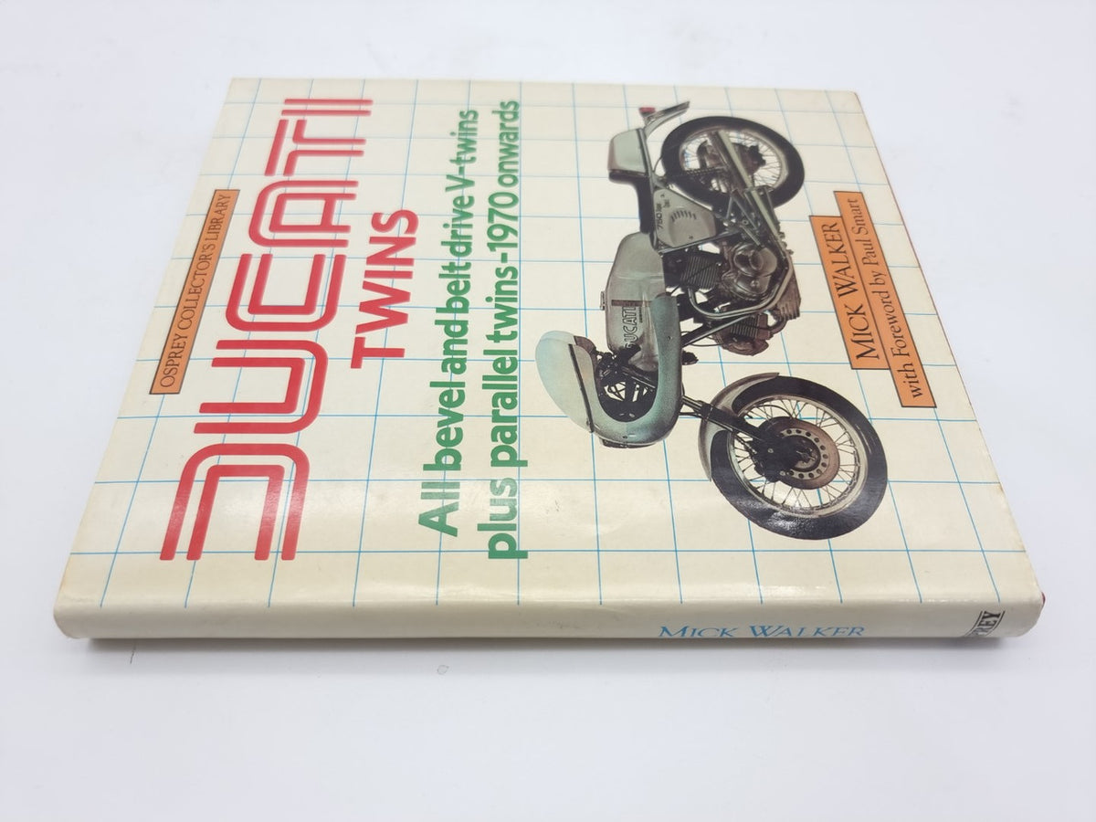 Motorcycle repair book back cover with Ducati Twins artwork and bike photo