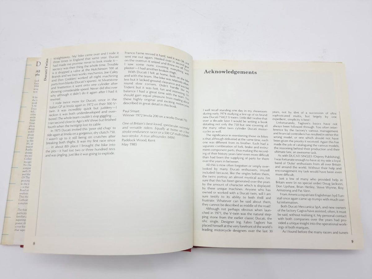 Motorcycle repair book open to acknowledgements page with dense paragraphs