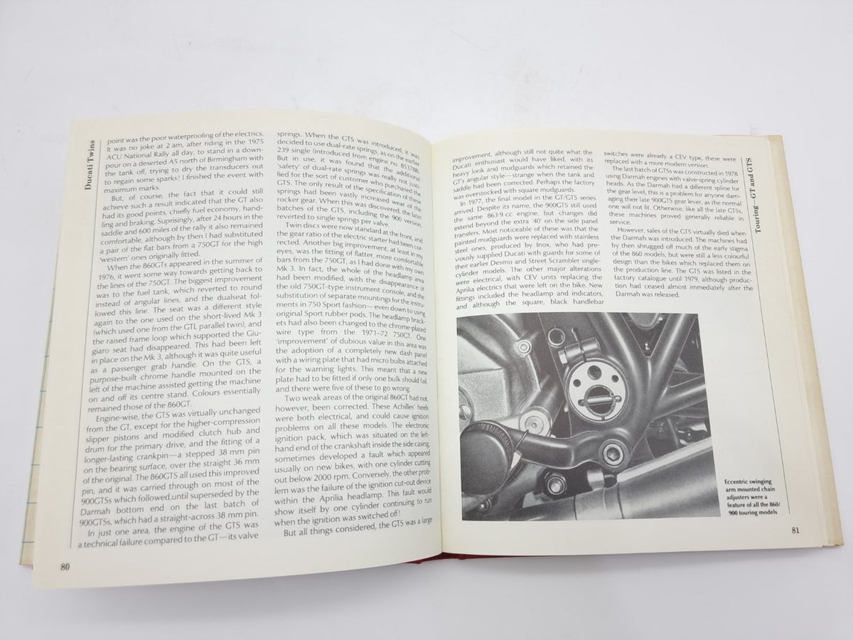 Open book spread with engine photo and paragraphs on both pages