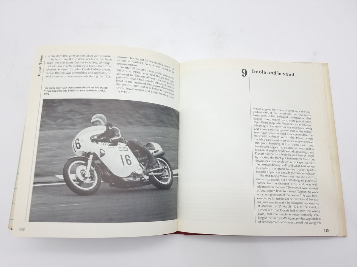 Open book spread with two-page layout and grayscale motorcycle photo