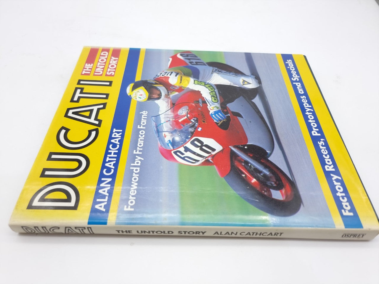 Ducati racing book with red motorcycle photo and yellow title spine
