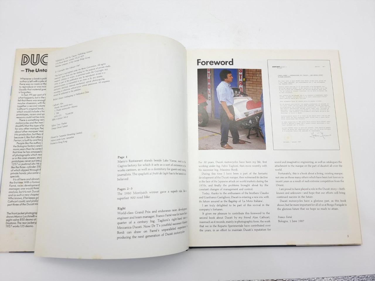 Open Ducati racing book showing Forward section and photographs on both pages