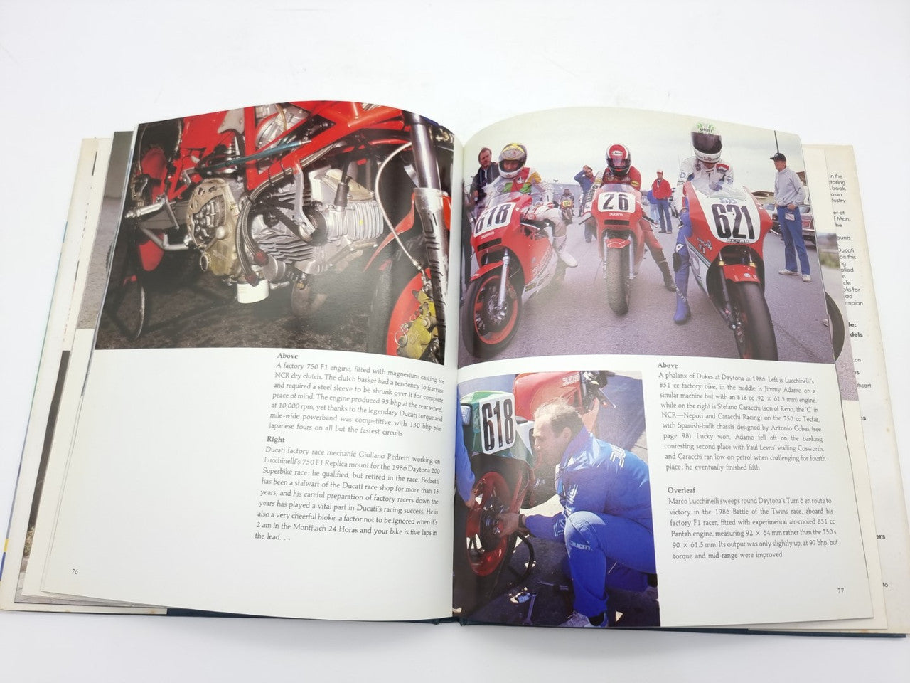 Open Ducati racing book with crew and rider photos beside caption text