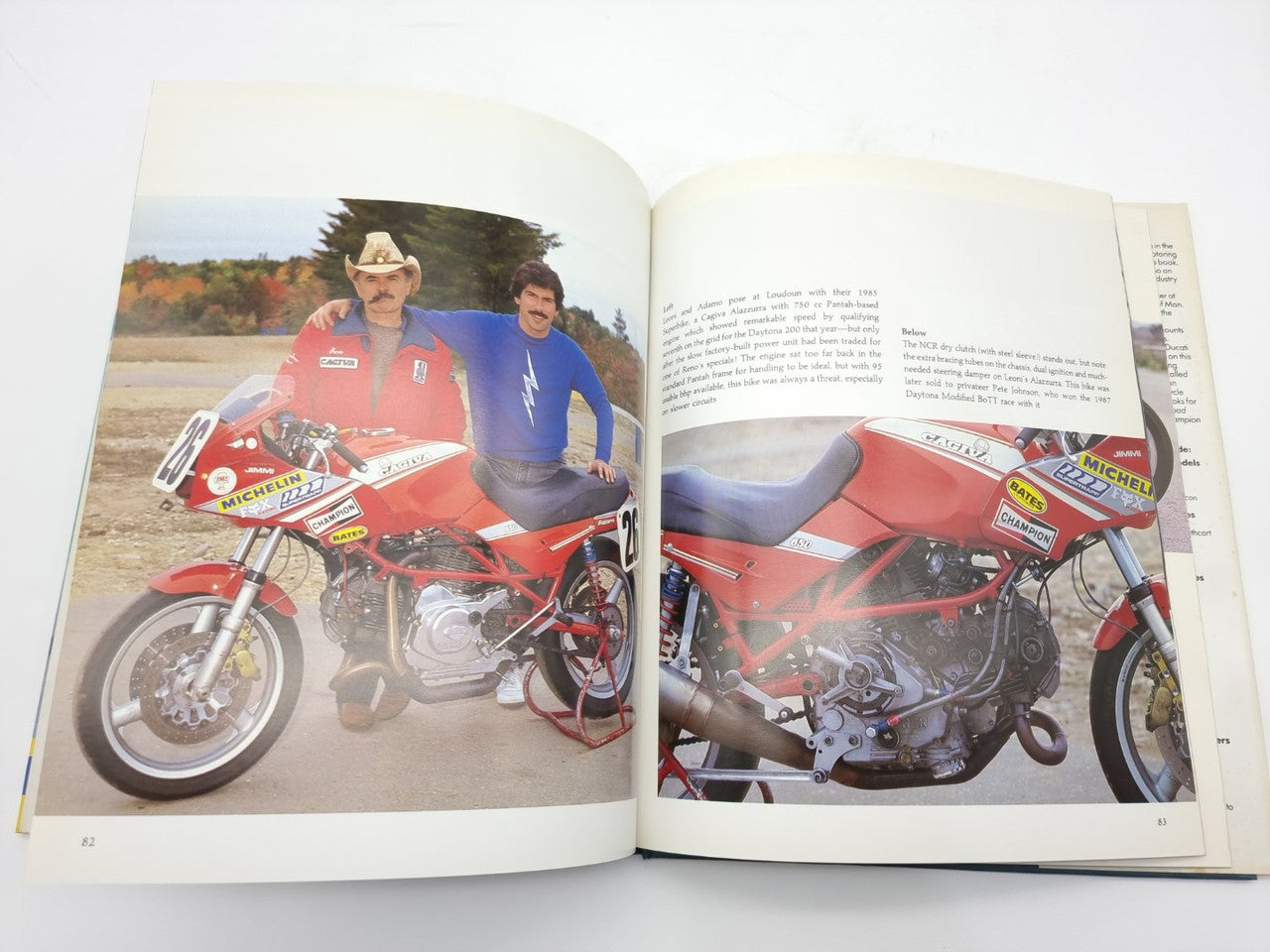 Open Ducati motorcycle history book with red bike photo on left page, captions on right