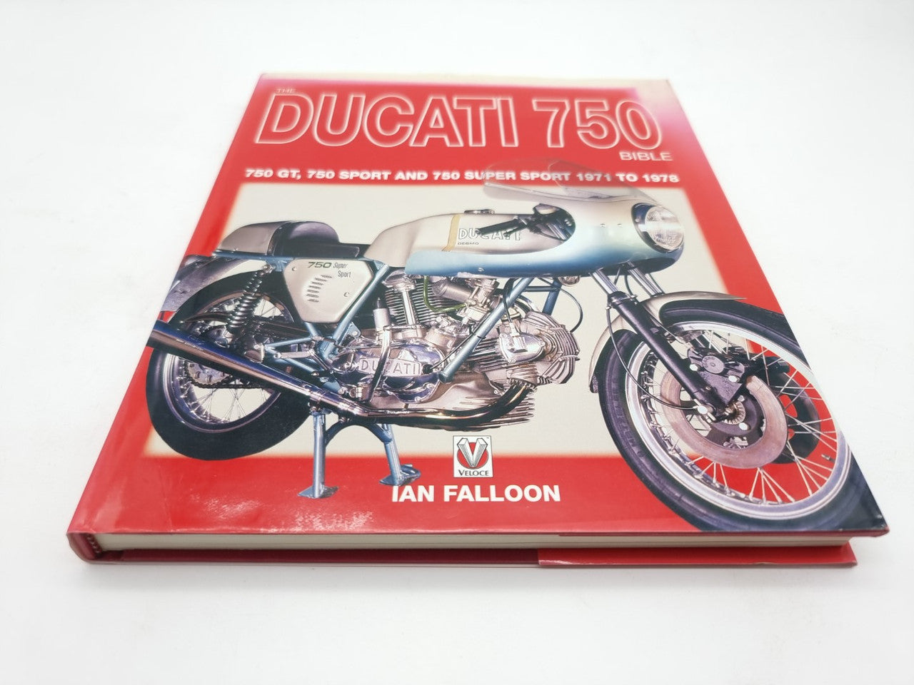 Motorcycle guide book front cover with red border and classic motorcycle illustration