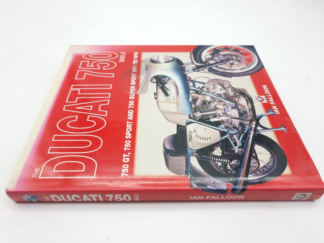 Motorcycle history book cover featuring Ducati 750 text and motorcycle artwork