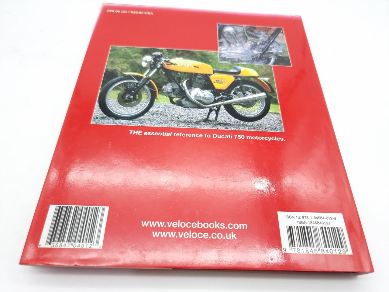 Motorcycle guide book with red back cover and small motorcycle photo