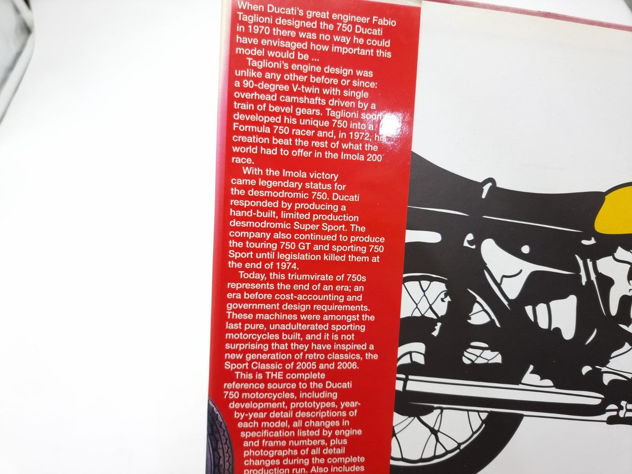 Motorcycle guide book page with red text block and black illustration on the margin