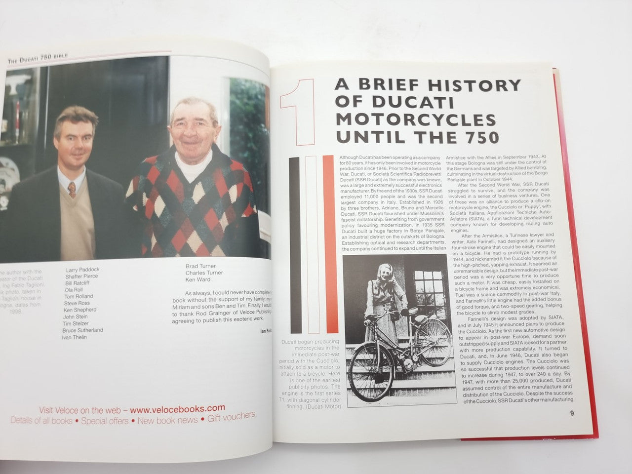 Motorcycle guide book open to history page with portraits and vintage motorcycle photo