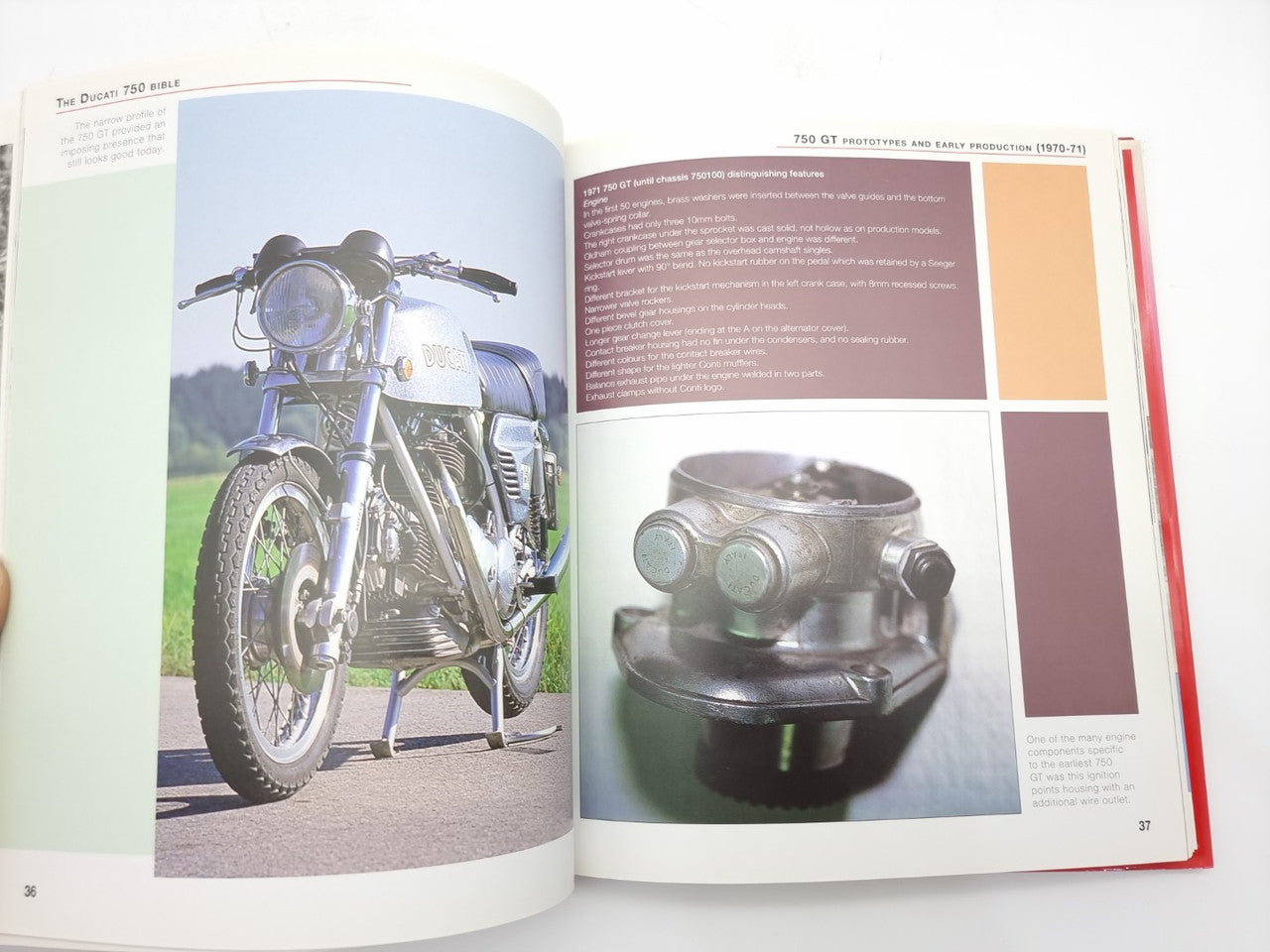 Open motorcycle history book with color photos of a motorcycle and engine close-up