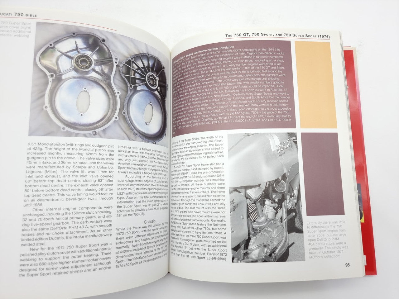 Motorcycle guide book open to engine diagram page with labeled parts
