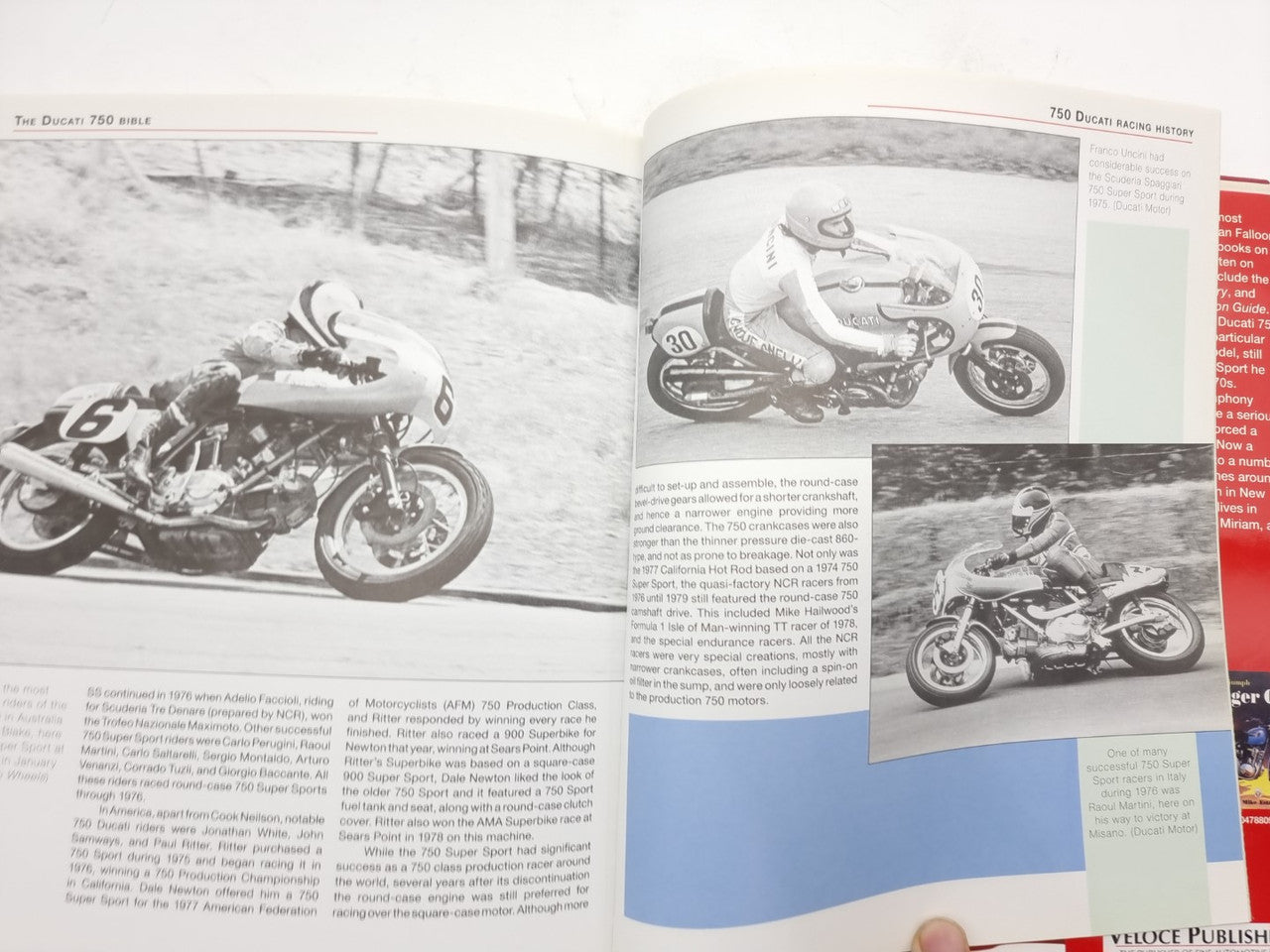 Motorcycle guide book open to action photo spread with race motorcycles