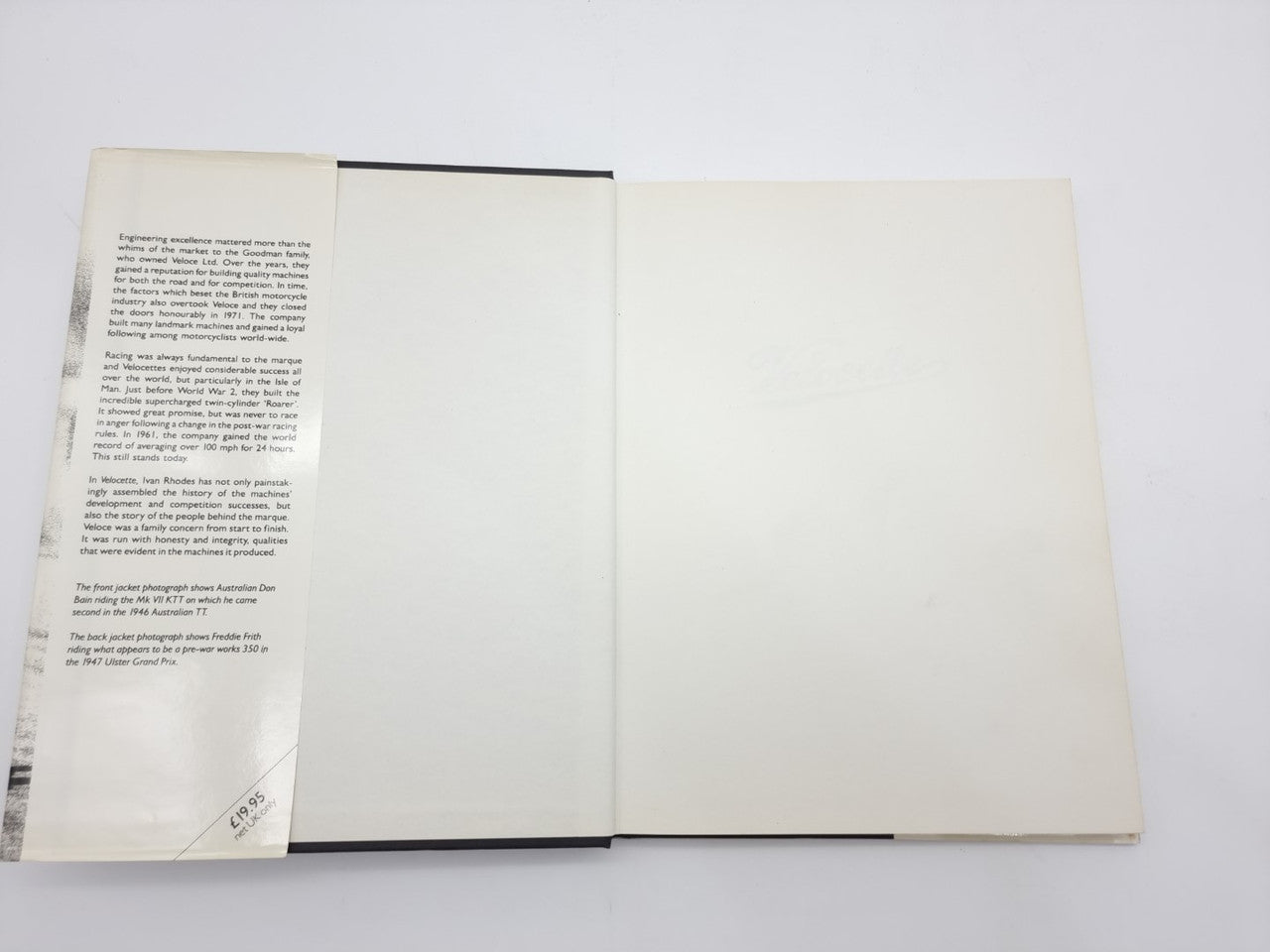 Open hardcover book showing two blank white pages