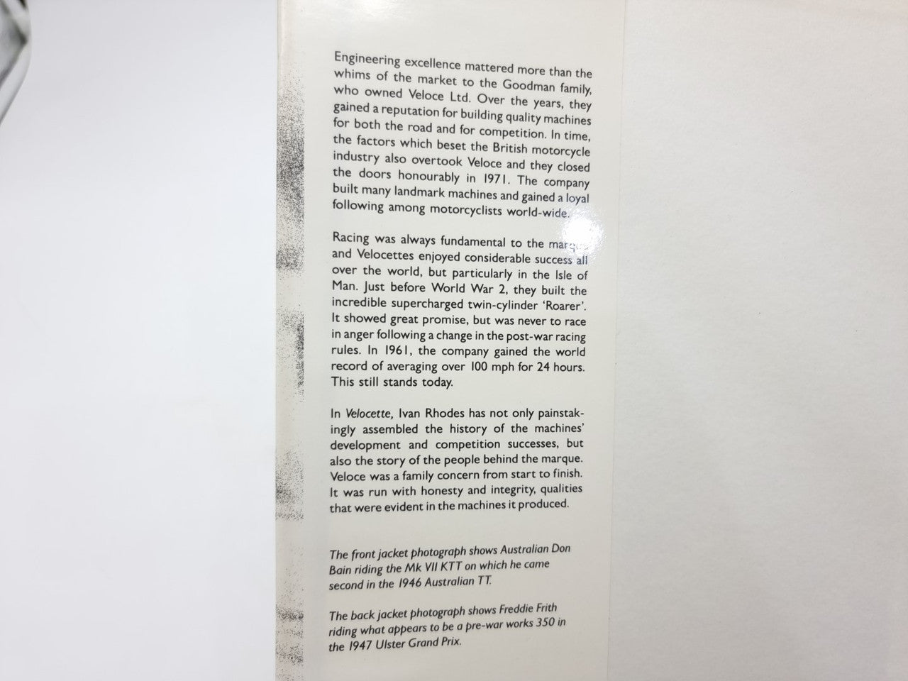 Hardcover book page with dense printed text in paragraphs
