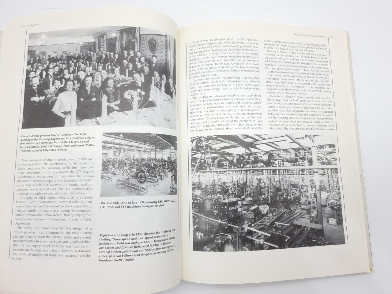Open book with black-and-white motorcycle factory photos on two pages