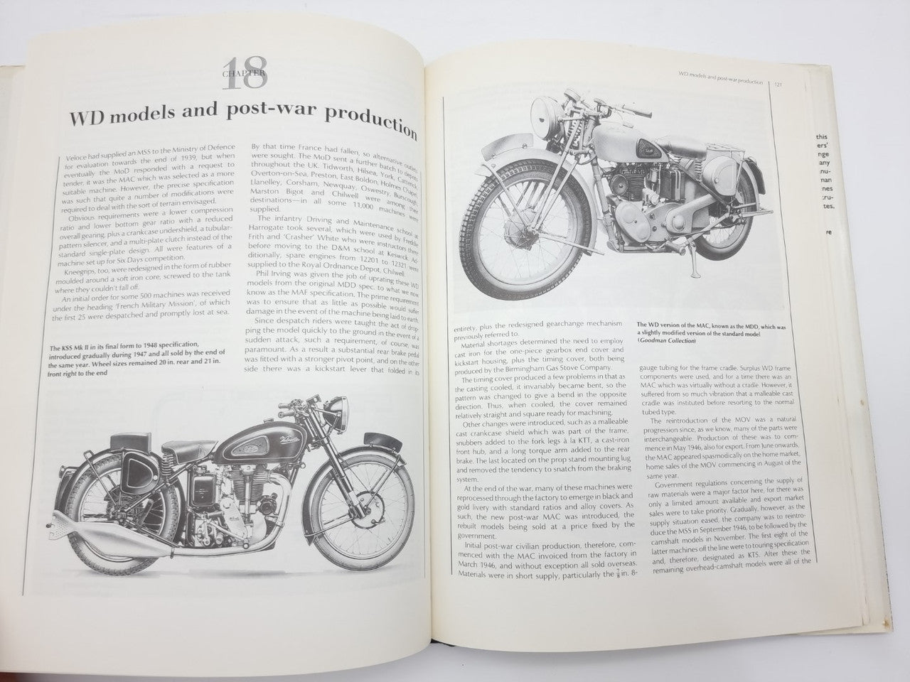 Open hardcover book with text and black-and-white motorcycle photos and diagrams