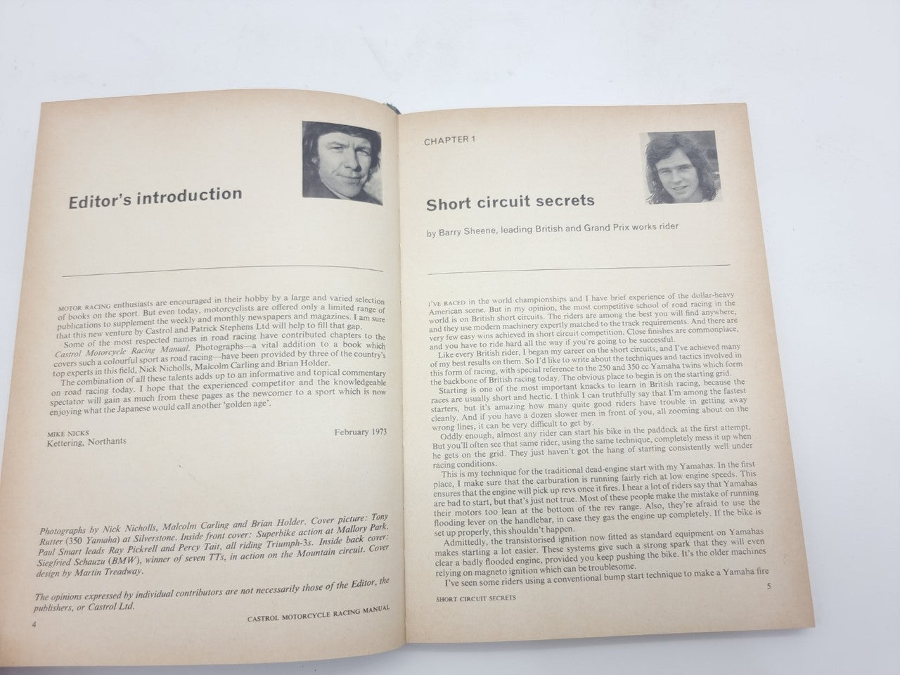 Open motorcycle racing manual showing editor’s introduction and chapter text with portrait photos