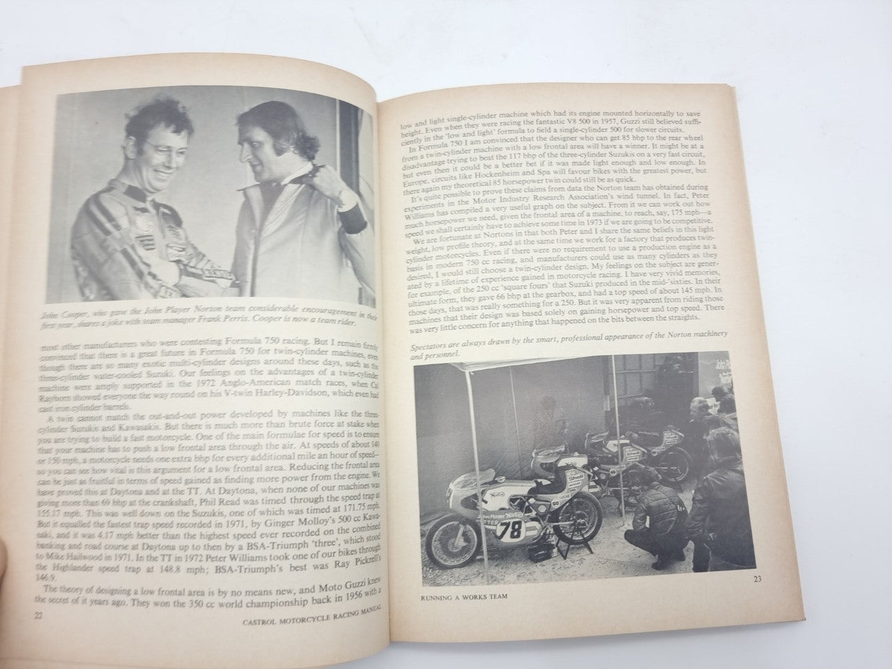 Open motorcycle racing manual showing two people portrait photo and a small bike workshop photo