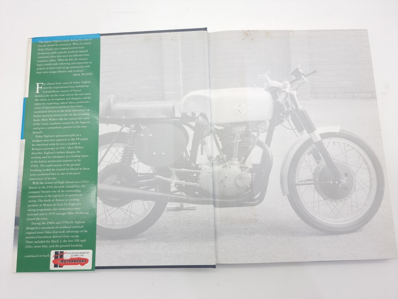 Open book showing motorcycle photo spread with green left text column