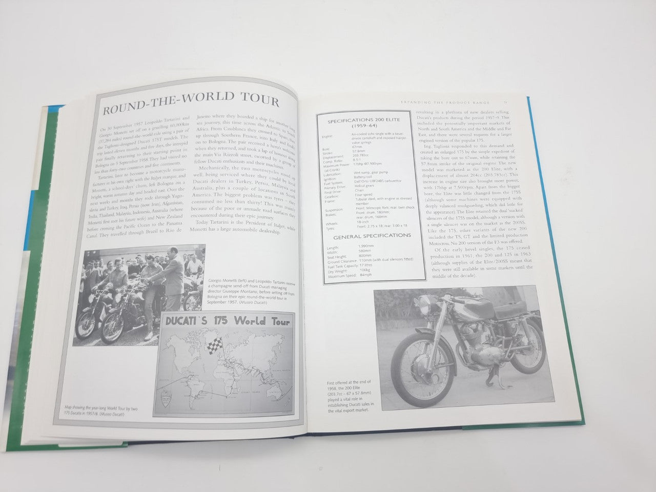 Open book spread with 'Round-the-World Tour' text and motorcycle photos