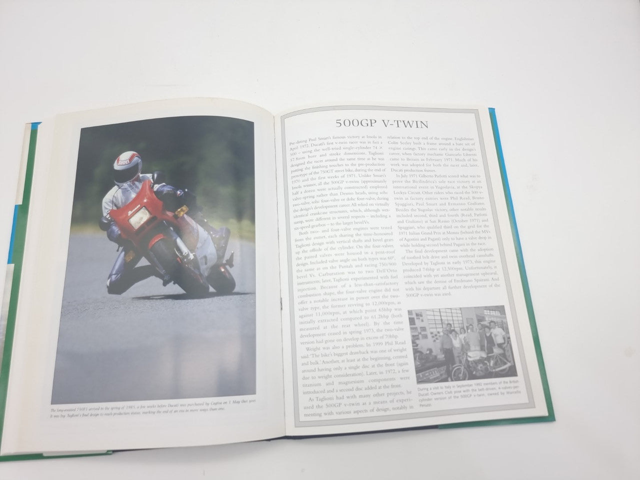 Motorcycles book opened with a Ducati photo page and text column layout