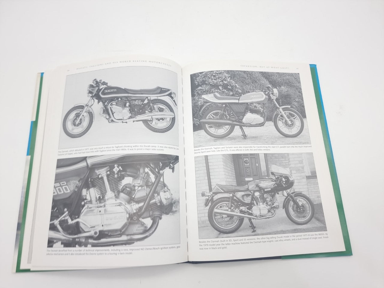 Motorcycles book opened to photo pages showing multiple classic bikes