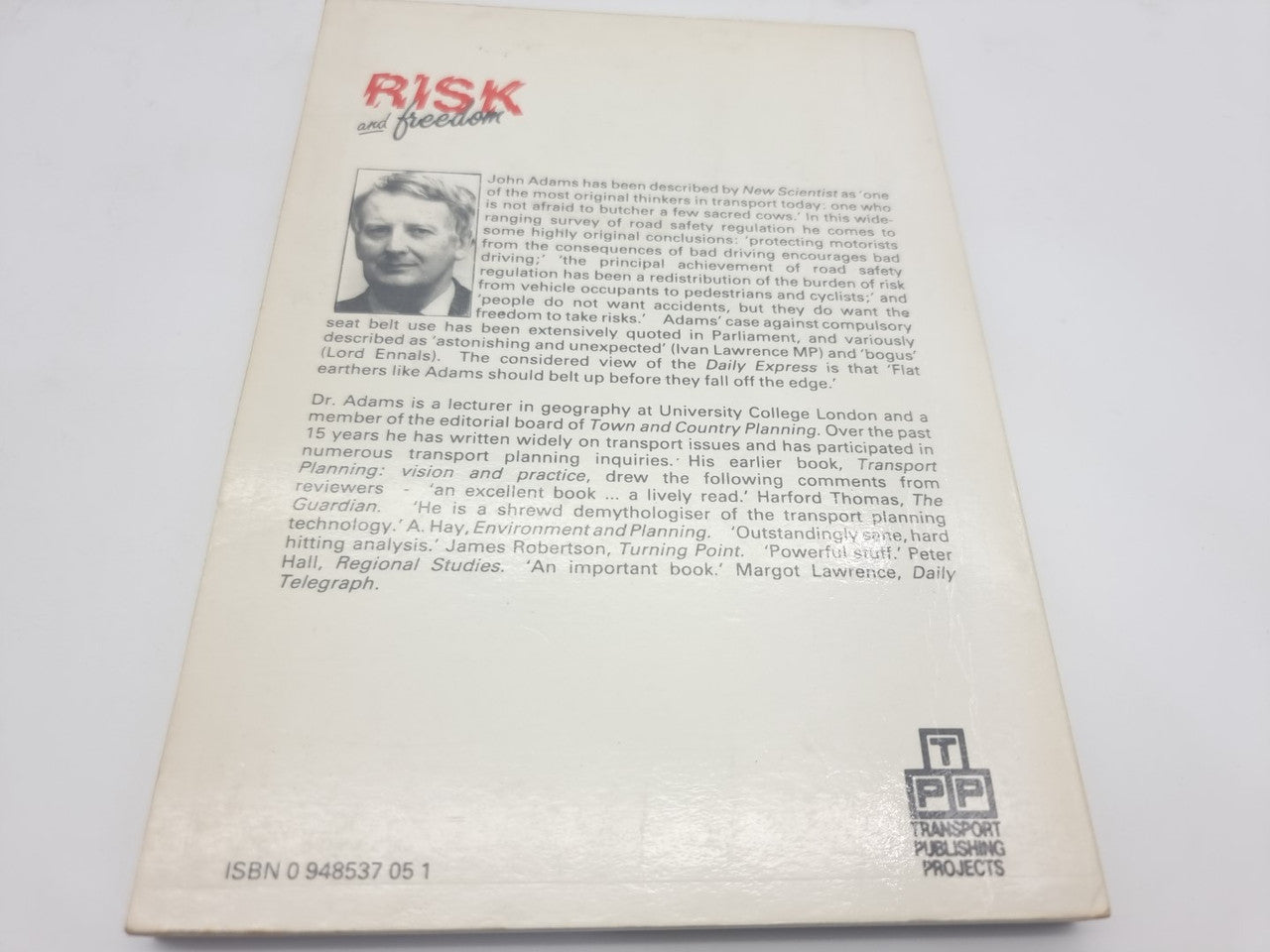 Book back cover with author bio text and publisher logo