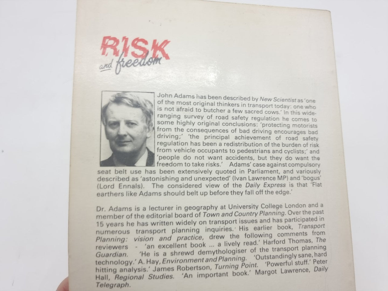 Book page with author portrait and dense text under title