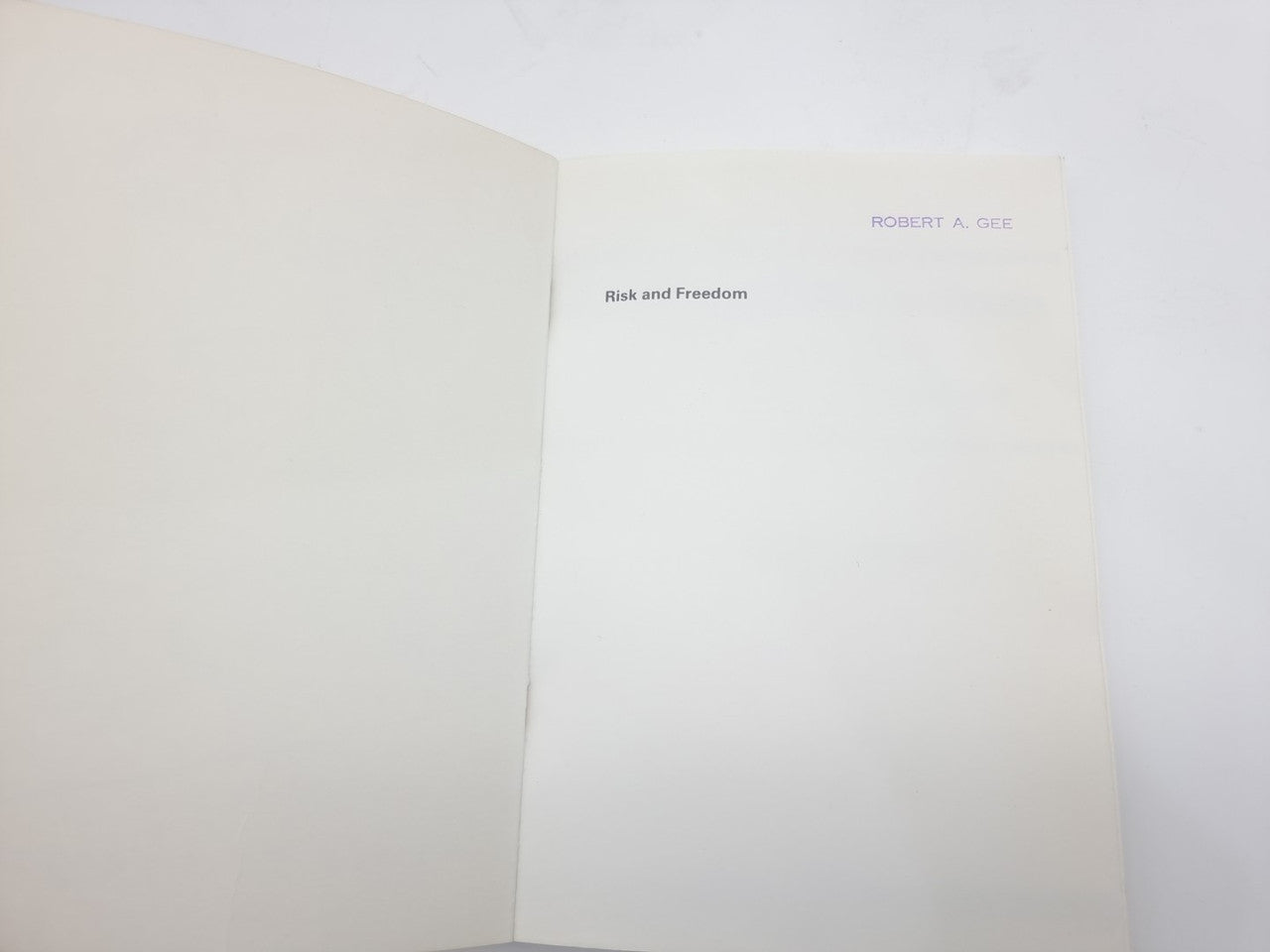 Opened book with header text on right page and blank left page