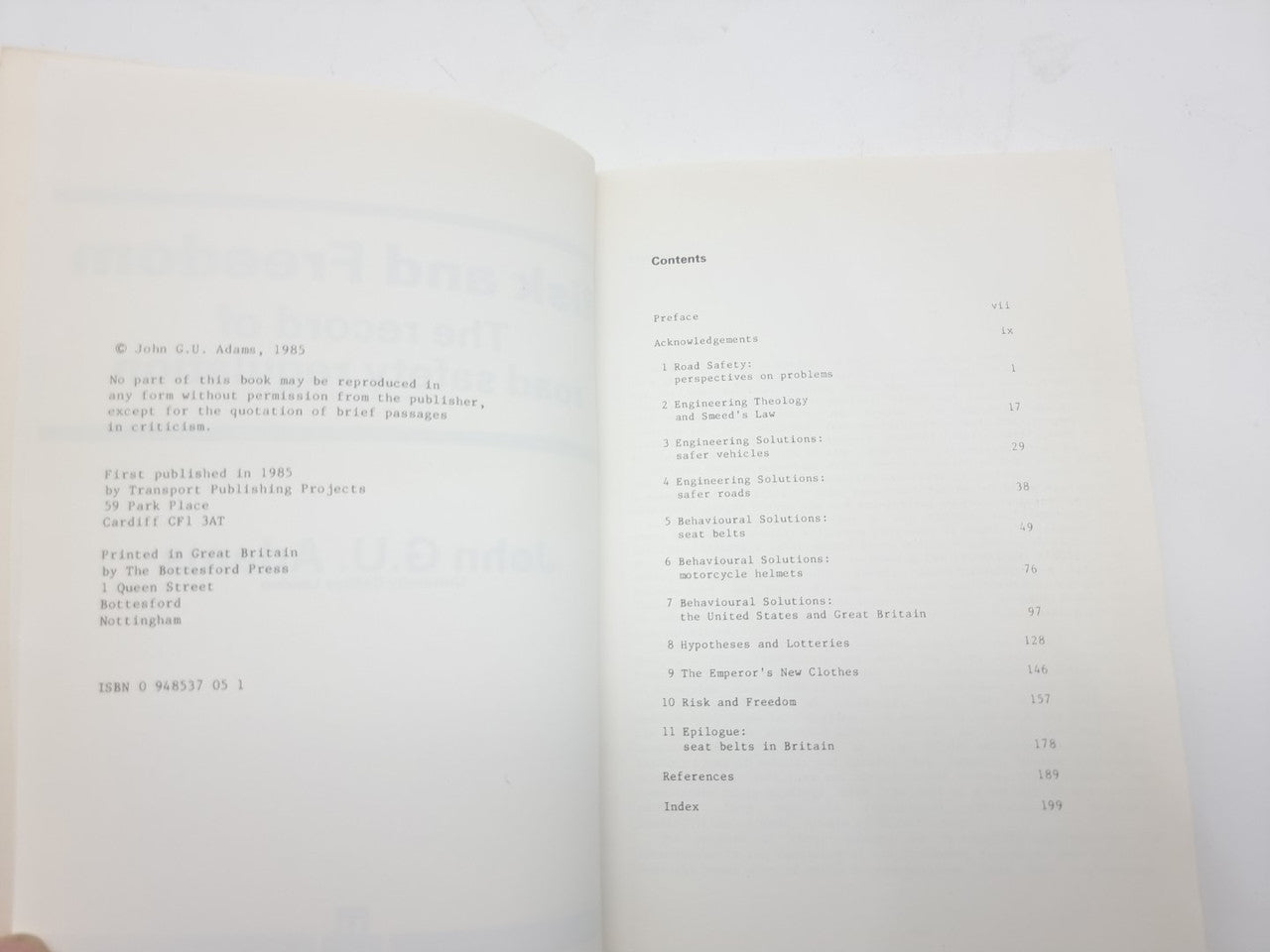 Opened book with table of contents text on both pages